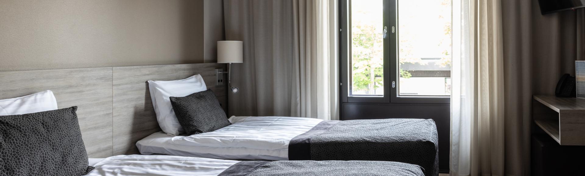 Modern and fresh Classic Twin room category in Hotel Pommern with two separate twin beds