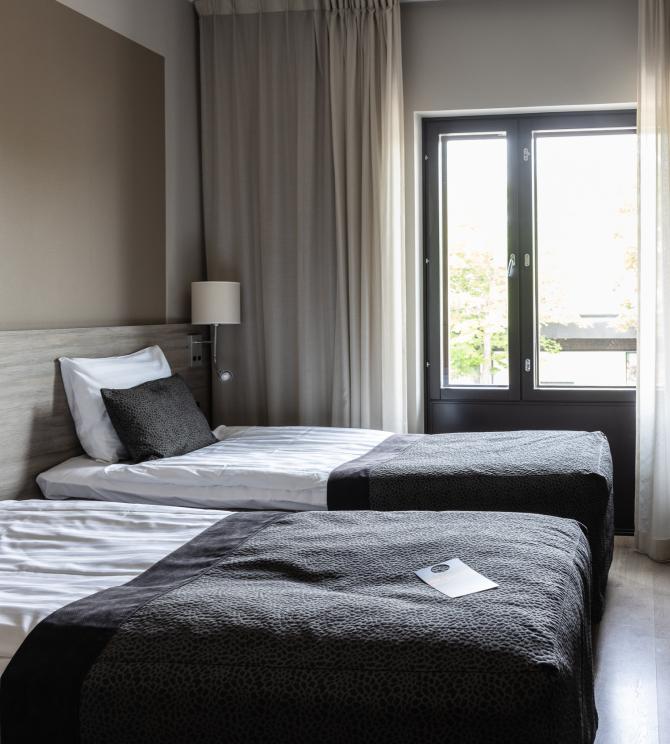 Modern and fresh Classic Twin room category in Hotel Pommern with two separate twin beds